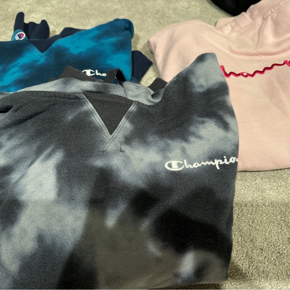 Bundle of 3 women’s large Champion hoodies.